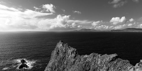 A black and white of Achill from the jagged rocks of Clare Island.