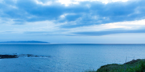 The stillness of the sea at Portstewart at sunset.