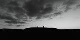 A dramatic dawn on the Hill of Tara in black and white.