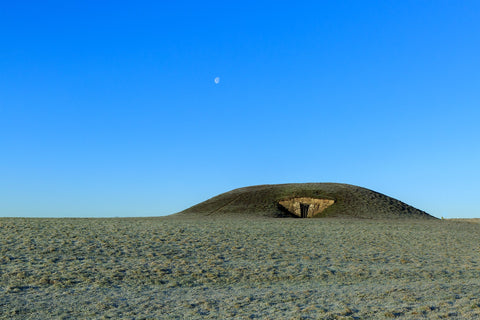 A cool winter morning with the moon still in the sky. The Mound of Hostages sits dominantly at the top of the Hill of Tara demanding the respect it deserves from the world around. The Mound of Hostages is a passage tomb that dates back to 3000BC – older than the pyramids of Egypt.