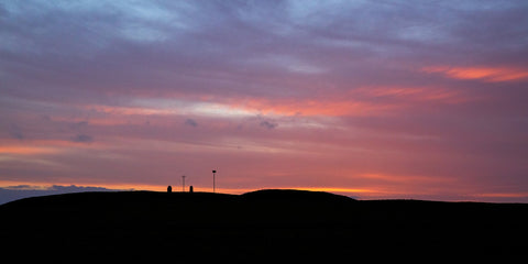 A gorgeous blue and pink sky at the Hill of Tara towards the Lia Fáil and memorial headstone.